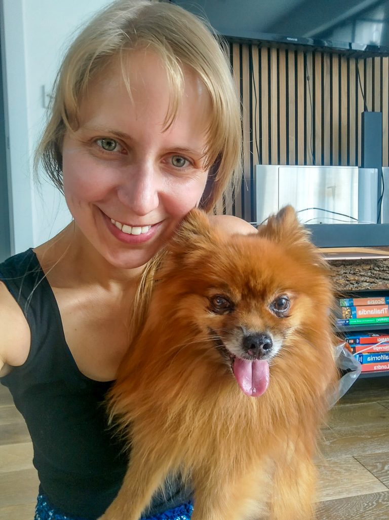 Cambridge dog walker and pet sitter, Steph, poses for a selfie with a happy Pomeranian.