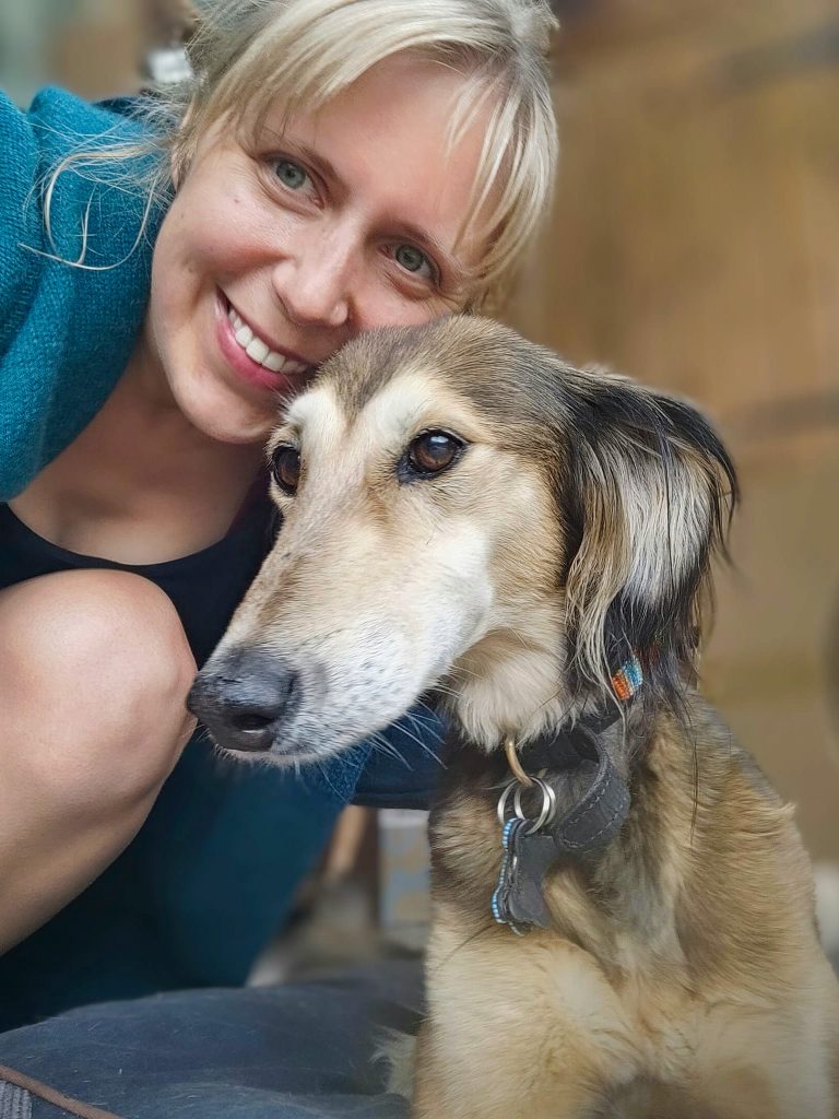 A beautiful saluki poses for a selfie with her dog sitter, Steph.